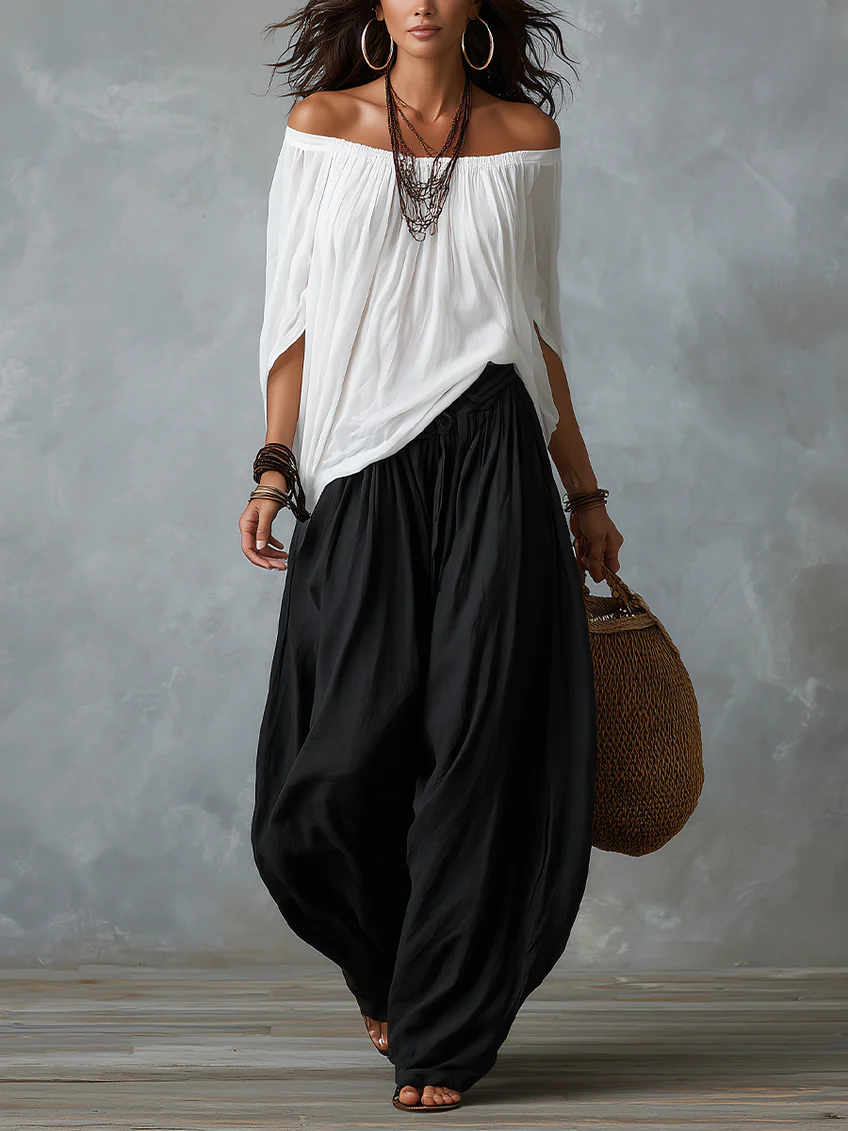 White off-shoulder top and flared lantern-style trousers