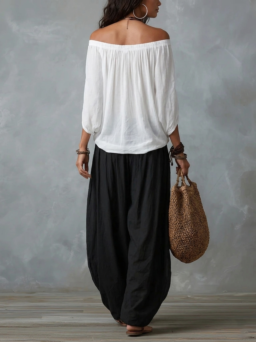 White off-shoulder top and flared lantern-style trousers