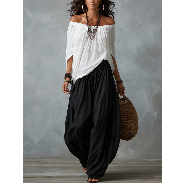 White off-shoulder top and flared lantern-style trousers